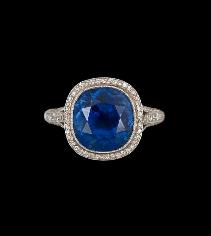 A sapphire, circa 11.25 cts, and old-cut diamond, total carat weight circa 1.00 ct, ring.