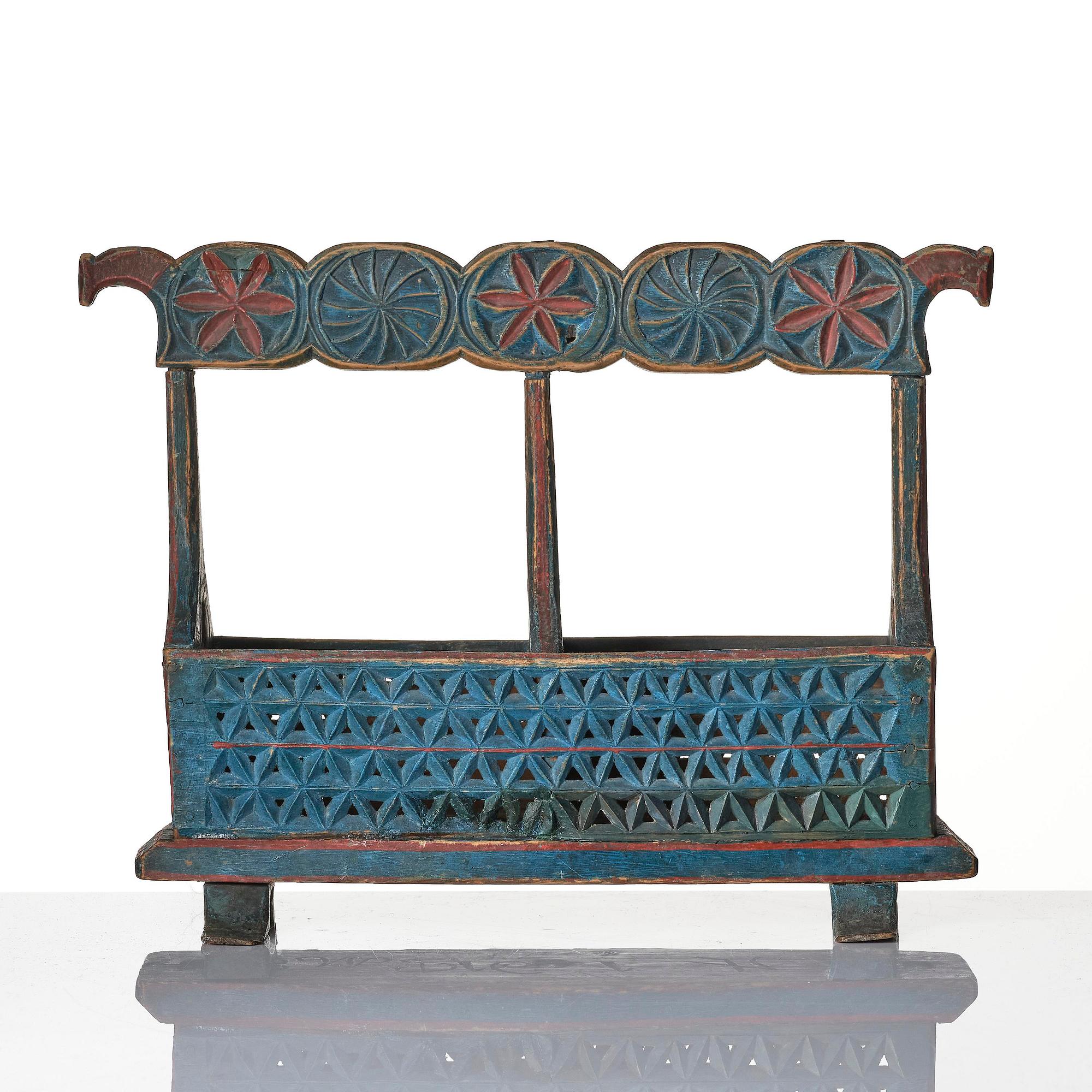 A Swedish folk art carved and painted bobin-holder, circa 1800.