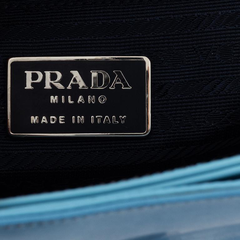 Prada, a blue patent leather bag.