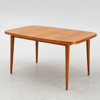 A dining table with six chairs, mid 20th century.