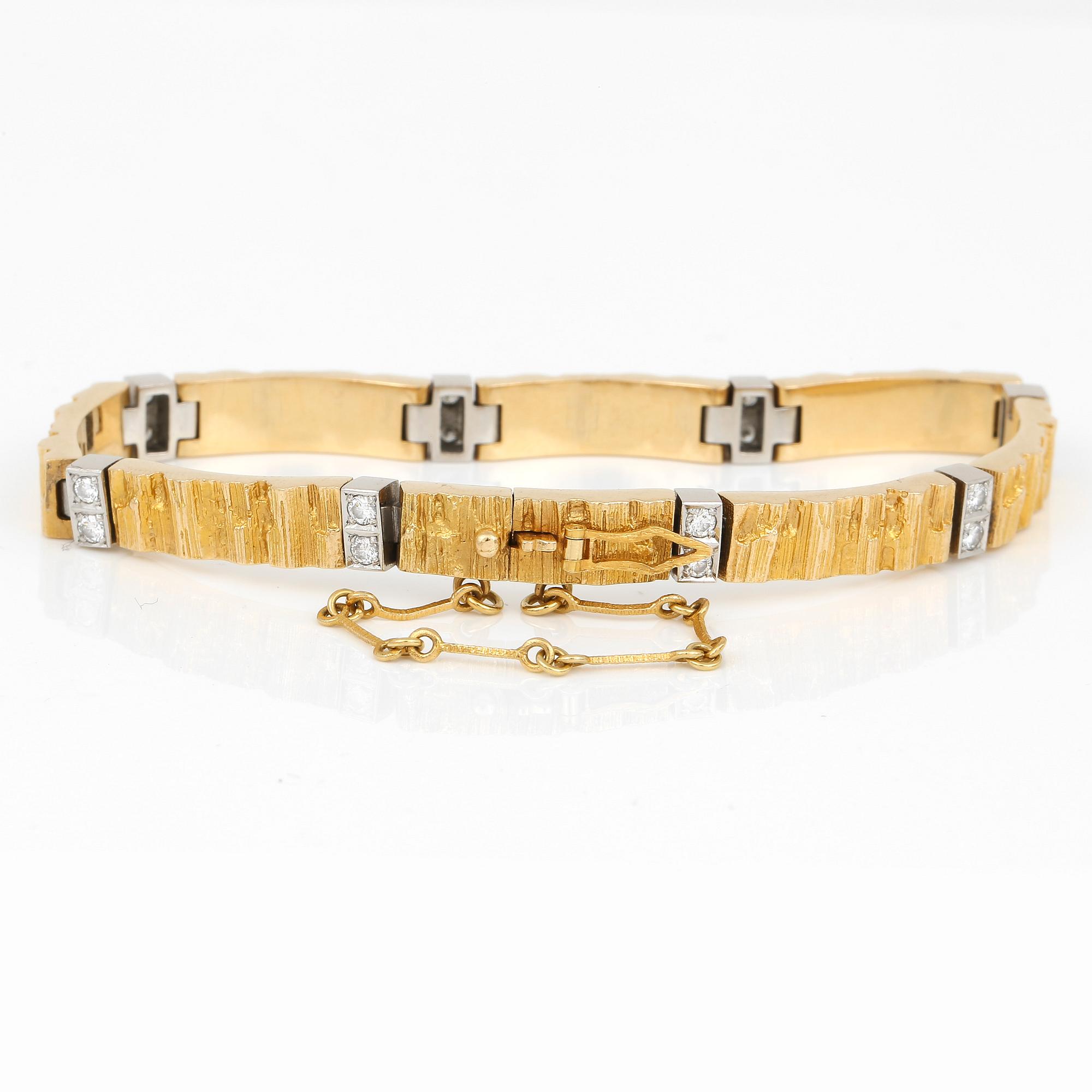 ARMBAND, 18K guld, 16 diamanter, Lapponia, 1984. Vikt ca 30g.
