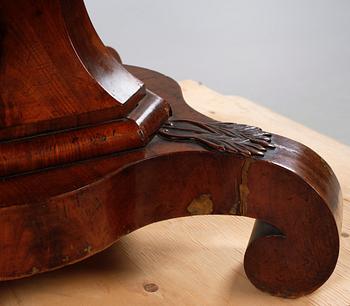 A late 19th century table with two extension leaves.