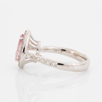 An 18K gold ring set with a faceted morganite.