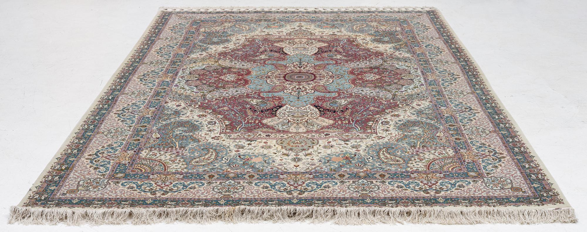 A Tabriz, carpet, 310 x 195 cm. signed.