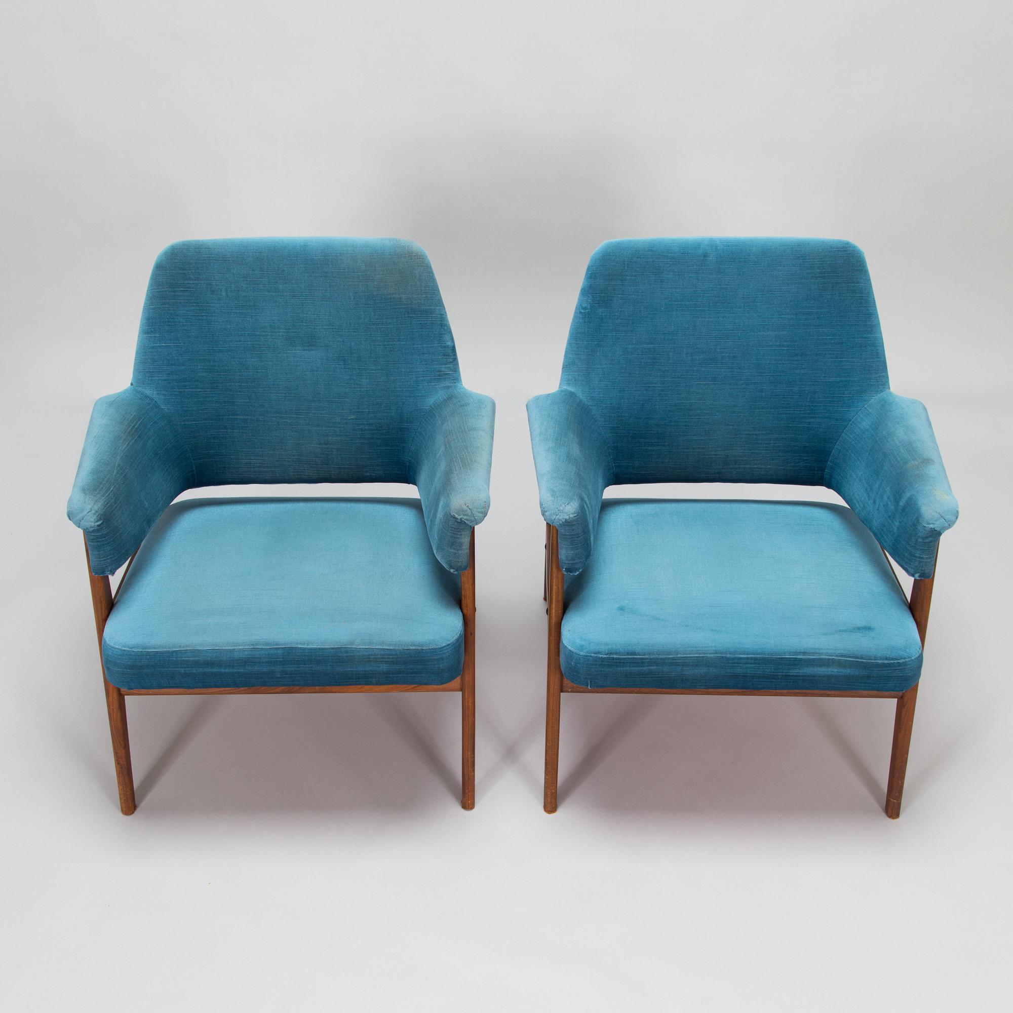 A pair of mid 20th century armchairs.