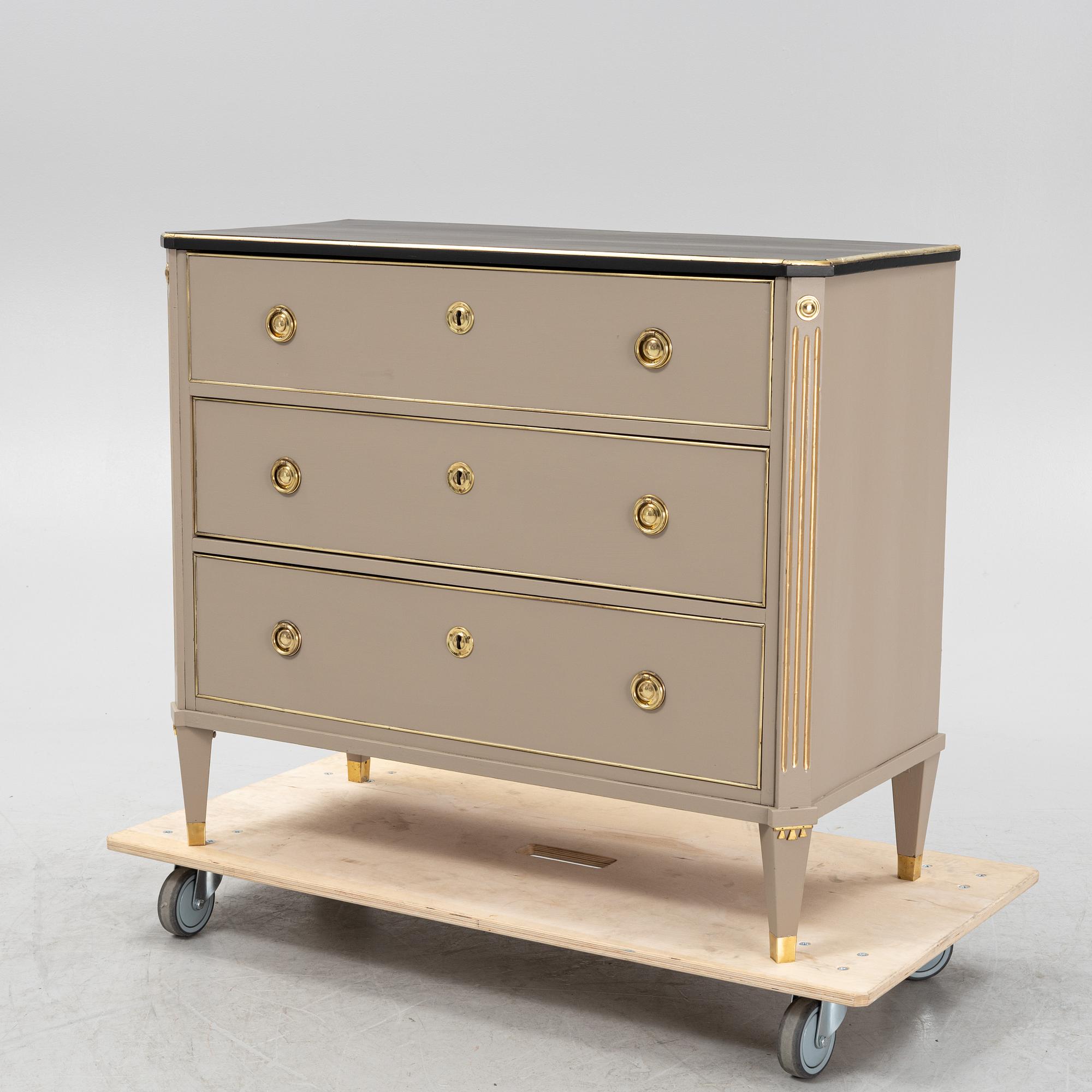 A painted Gustavian style chest of drawers from around the year 1900.