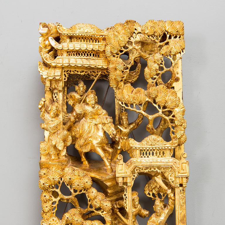 A Chinese carved and gilt wood panel, 20th century.