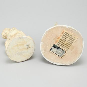 two plaster figurines, signed.