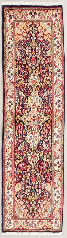 An old Kirman carpet 272x76 cm.