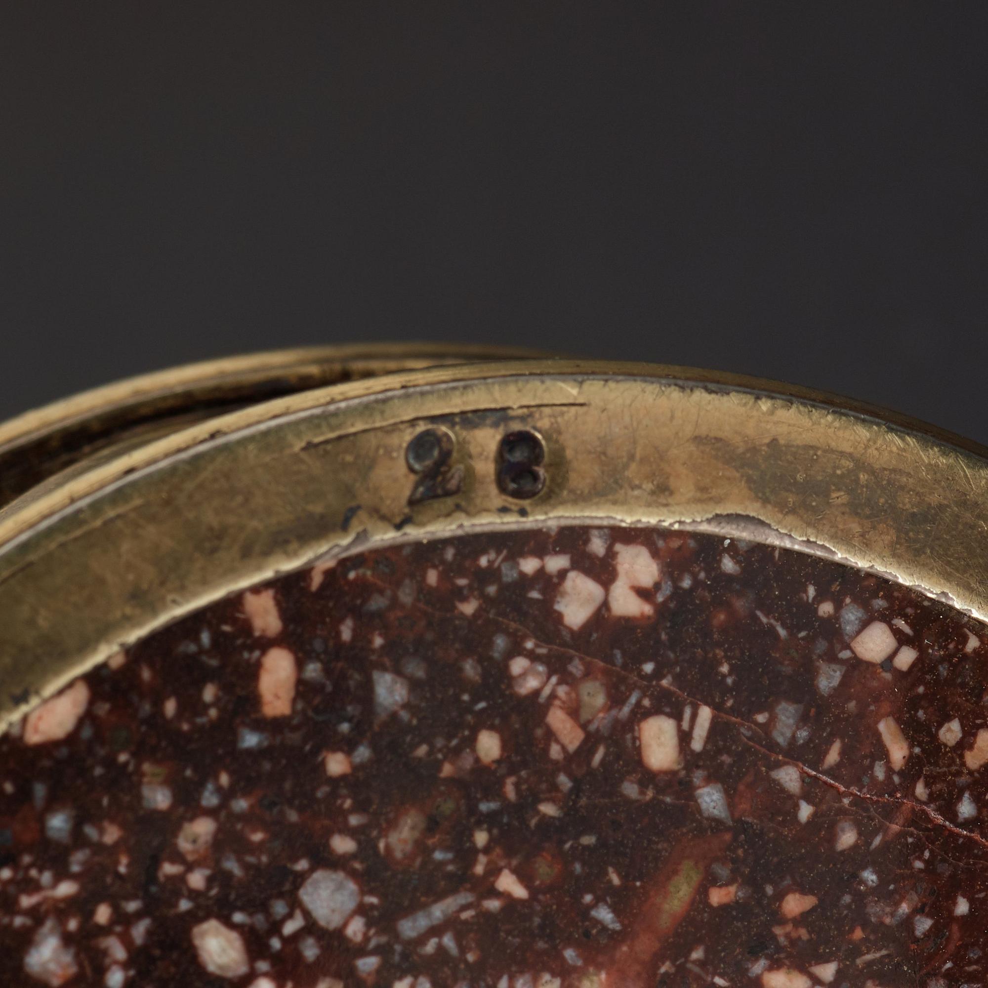 A pair of gilt silver and porphyry salts, by Gustaf Folcker, Stockholm 1827.