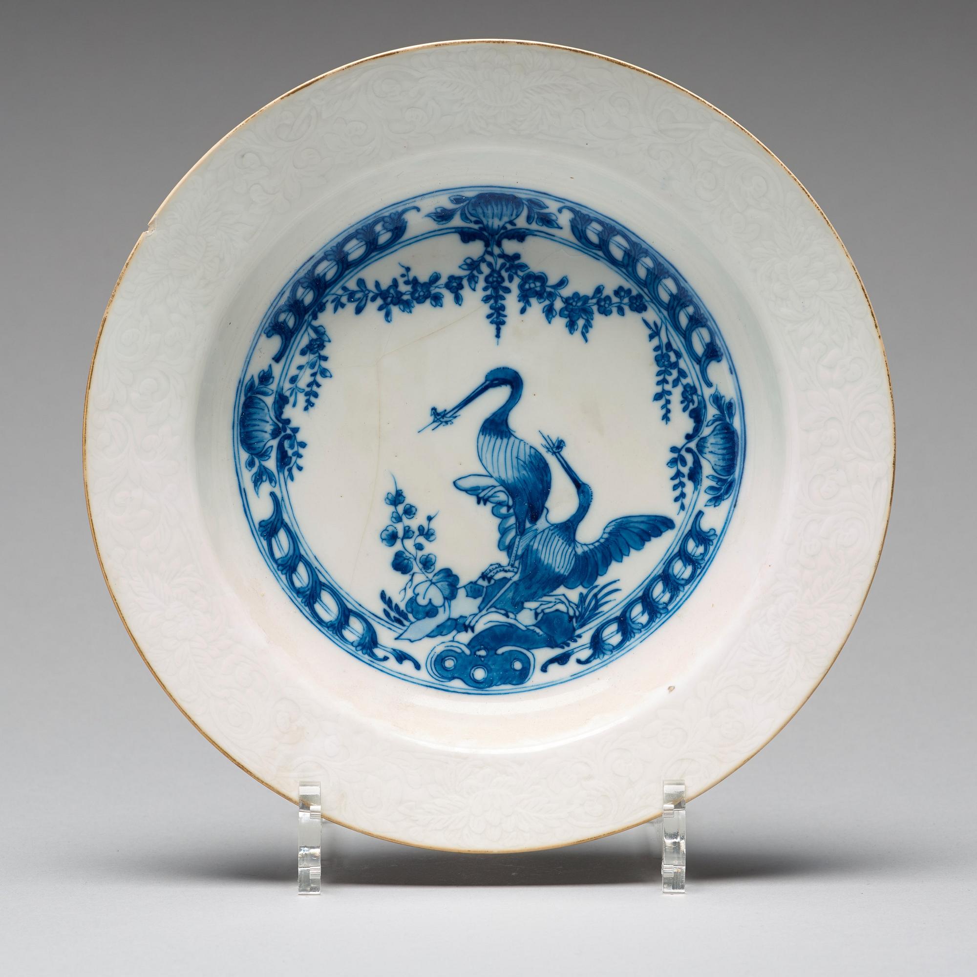 A set of eight blue and white armorial soup dishes, Qing dynasty, 18th Century.