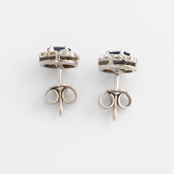 Pendant and a pair of earrings, white gold with sapphires and brilliant-cut diamonds.