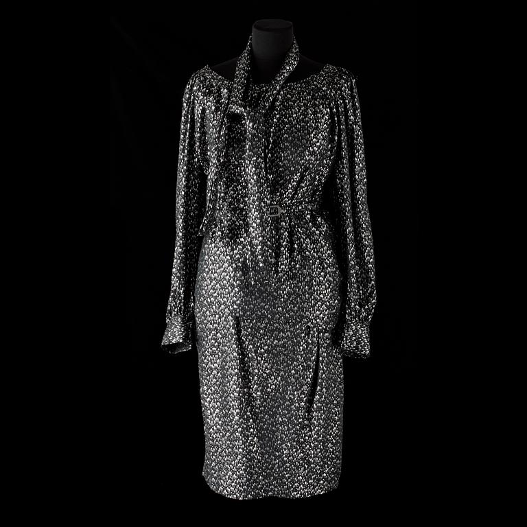 An ensemble consisting of skirt, top, belt and scarf by Christian Dior.