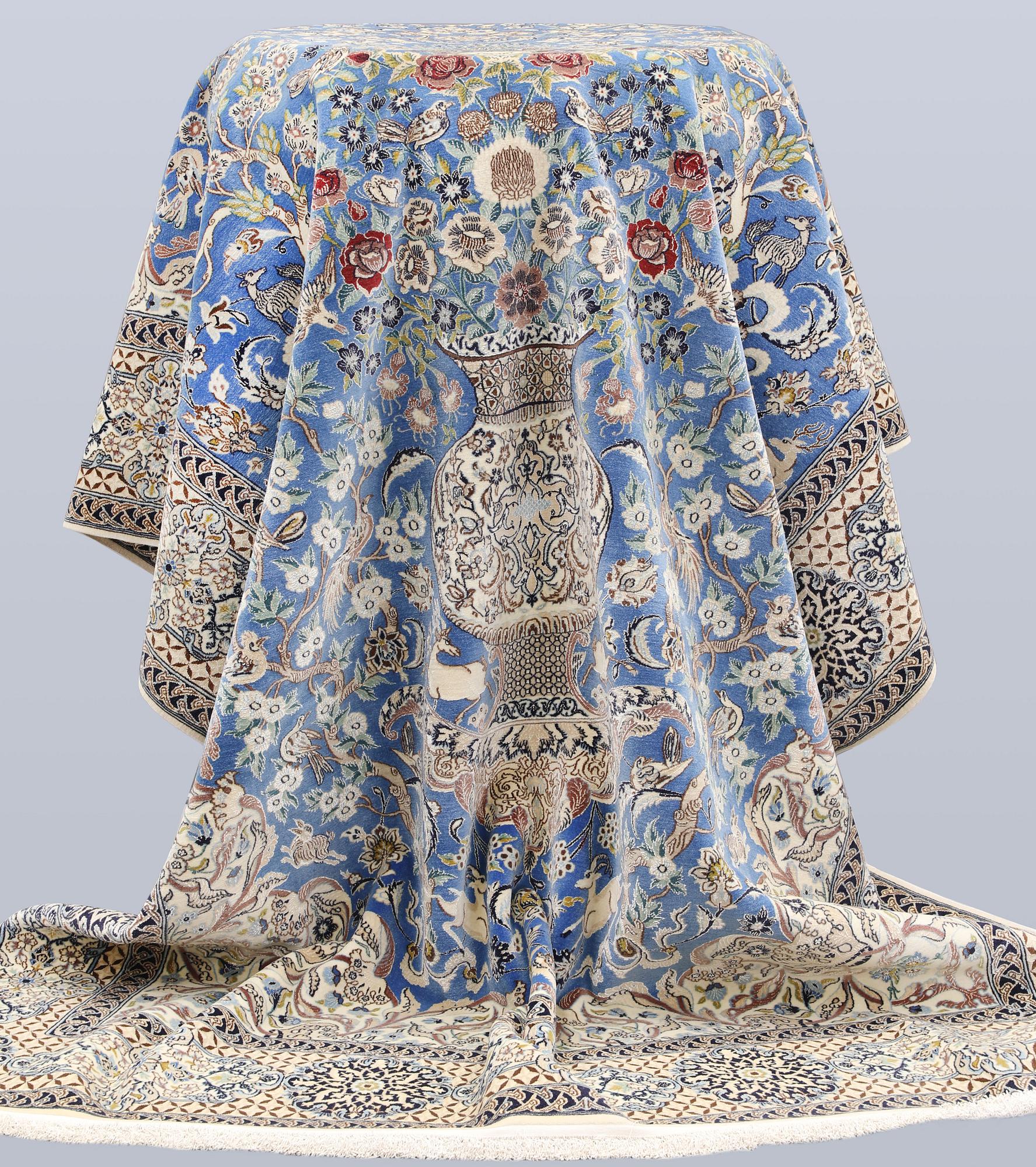 A Figural Nain-Isfahan carpet, part silk, 318 x 213 cm.