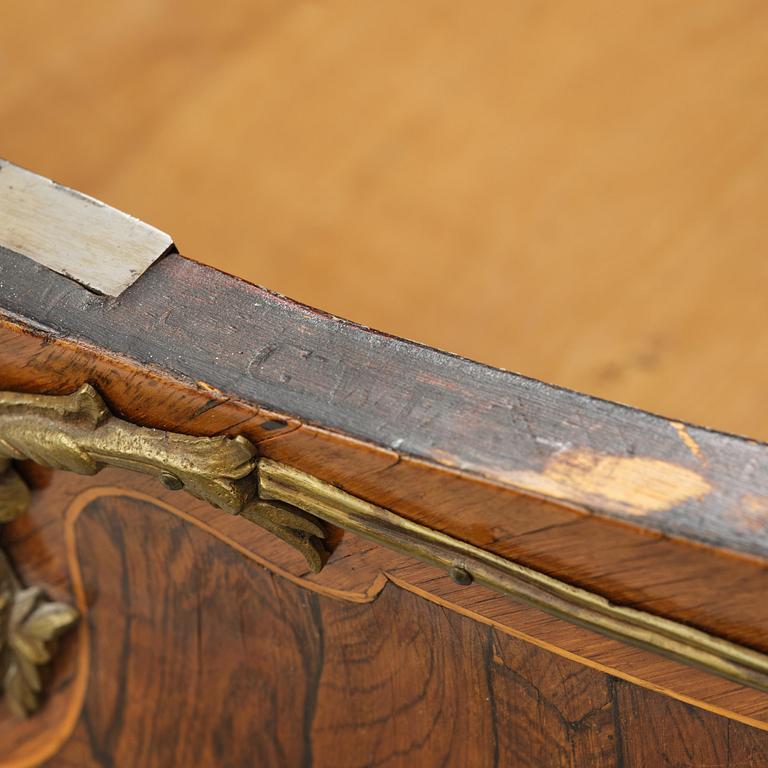 A rococo parquetry commode by C. G. Willkom (master in Stockholm 1763-65).