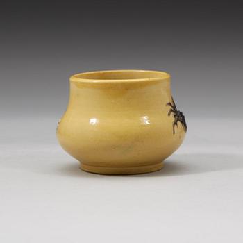 A yellow brush pot, Qing dynasty with Daoguang mark and period (1821-1850).