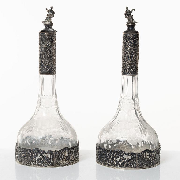 A pair of glass decanters with silver mounts, Swedish import marks, CG Hallberg, early 20th Century.