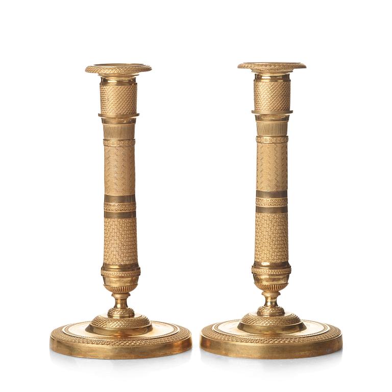 A pair of French Empire candlesticks, early 19th century.