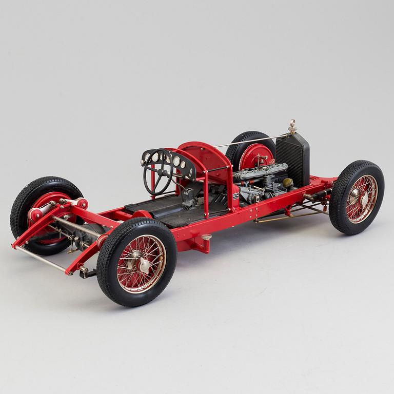 A plastic and metal model of an 1931 Alfa Romeo 8 C by Pocher.