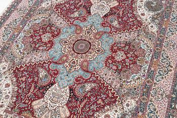 A Tabriz carpet, 210 x 195 cm. signed.