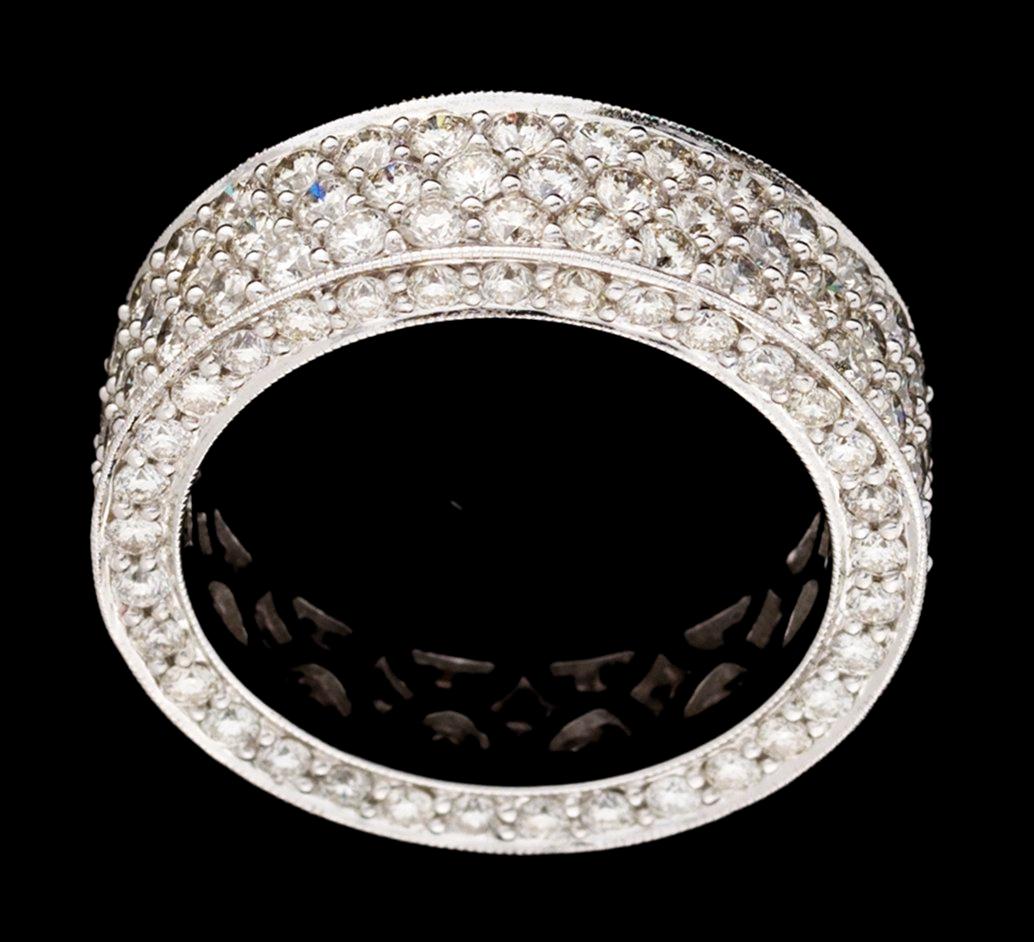A gold and diamond eternity ring.