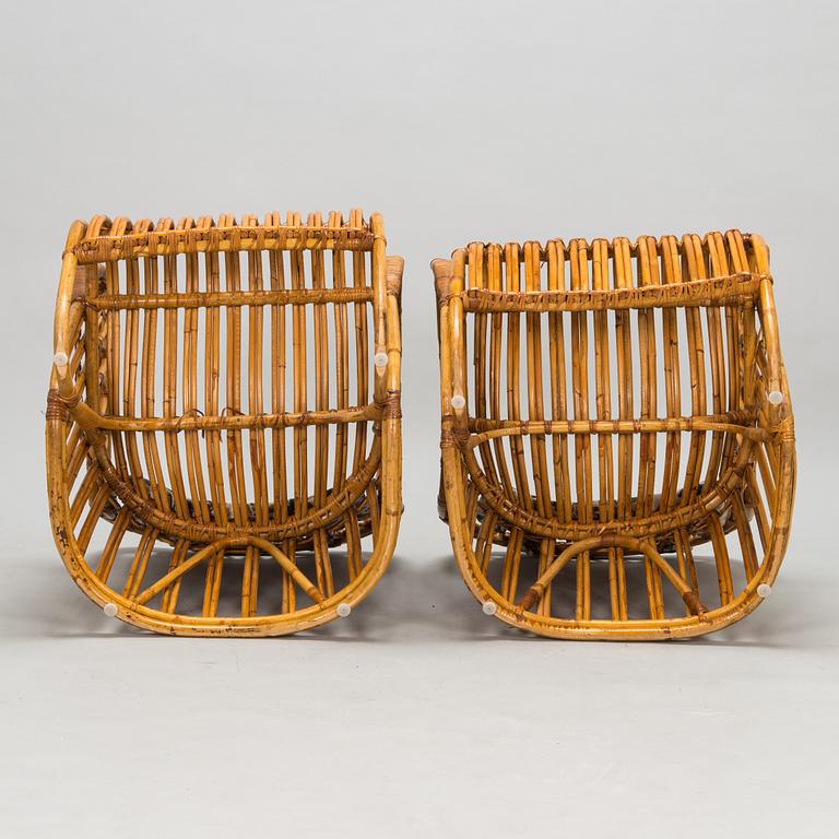 A pair of mid-20th-century rattan armchairs.