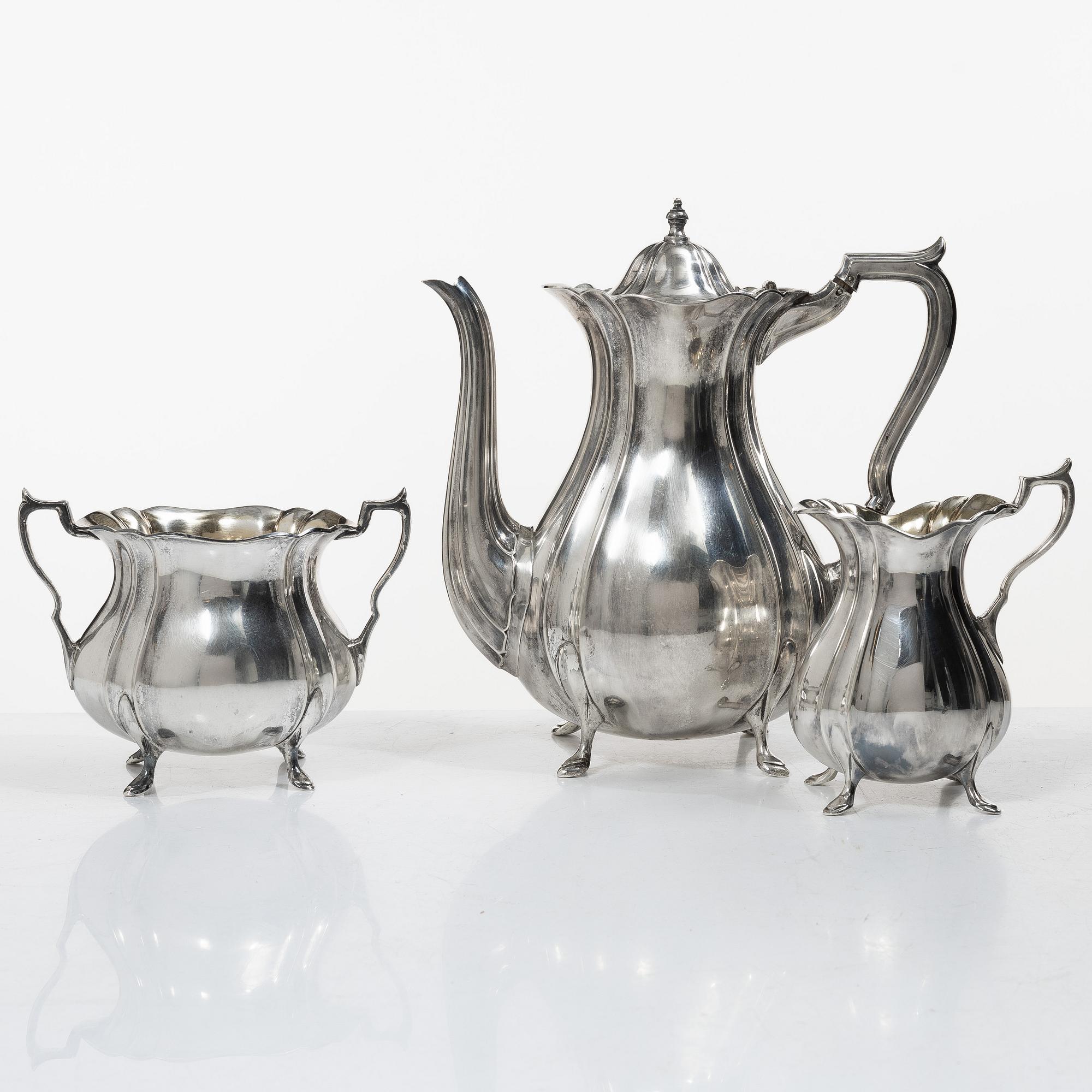 Guldsmedsaktiebolaget (GAB), A Swedish Rococo style silver coffee pot, cream jug and sugar bowl, mark of GAB, Stockholm 1918-1919.