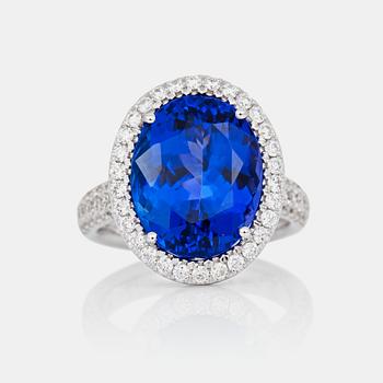 A 11.08 ct tanzanite and pavé-set brilliant-cut diamond ring. Total carat weight of diamonds 0.86 ct.