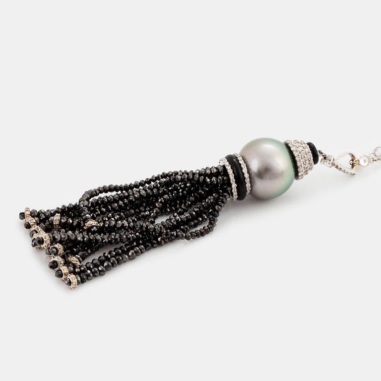 An Ebba Brahe 18K white gold tassel pendant with a cultured Tahitian pearl and white and black diamonds.