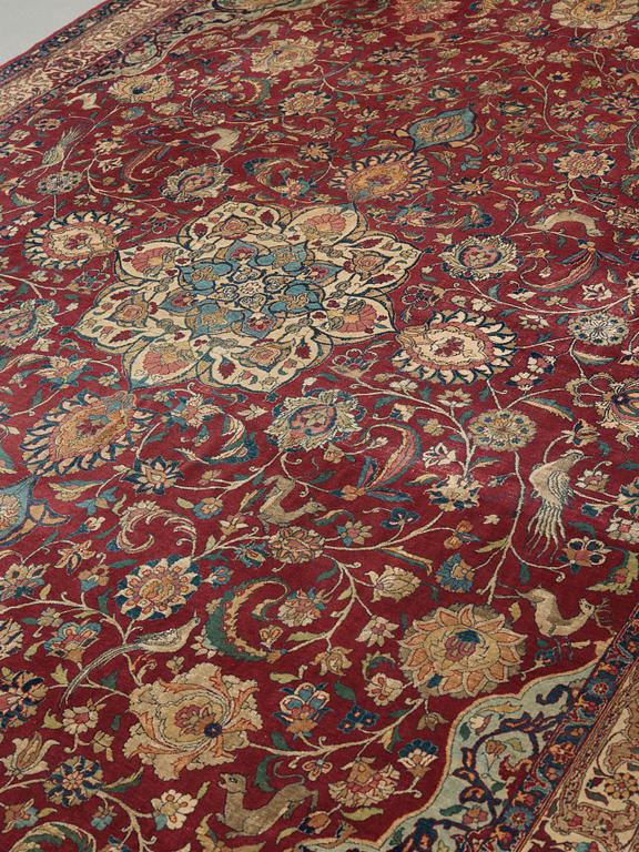 A CARPET, A semi-antique Esfahan part silk, ca 350,5 x 233,5 cm.