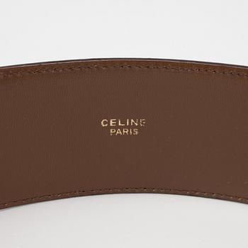 CÉLINE, a brandy coloured leather belt.