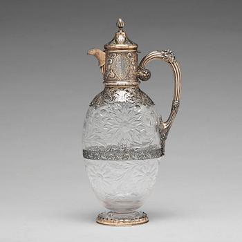 220. An English 19th century silver-gilt and glass wine-jug, marked Hunt & Roskell Late Storr & Mortimer, London 1895.