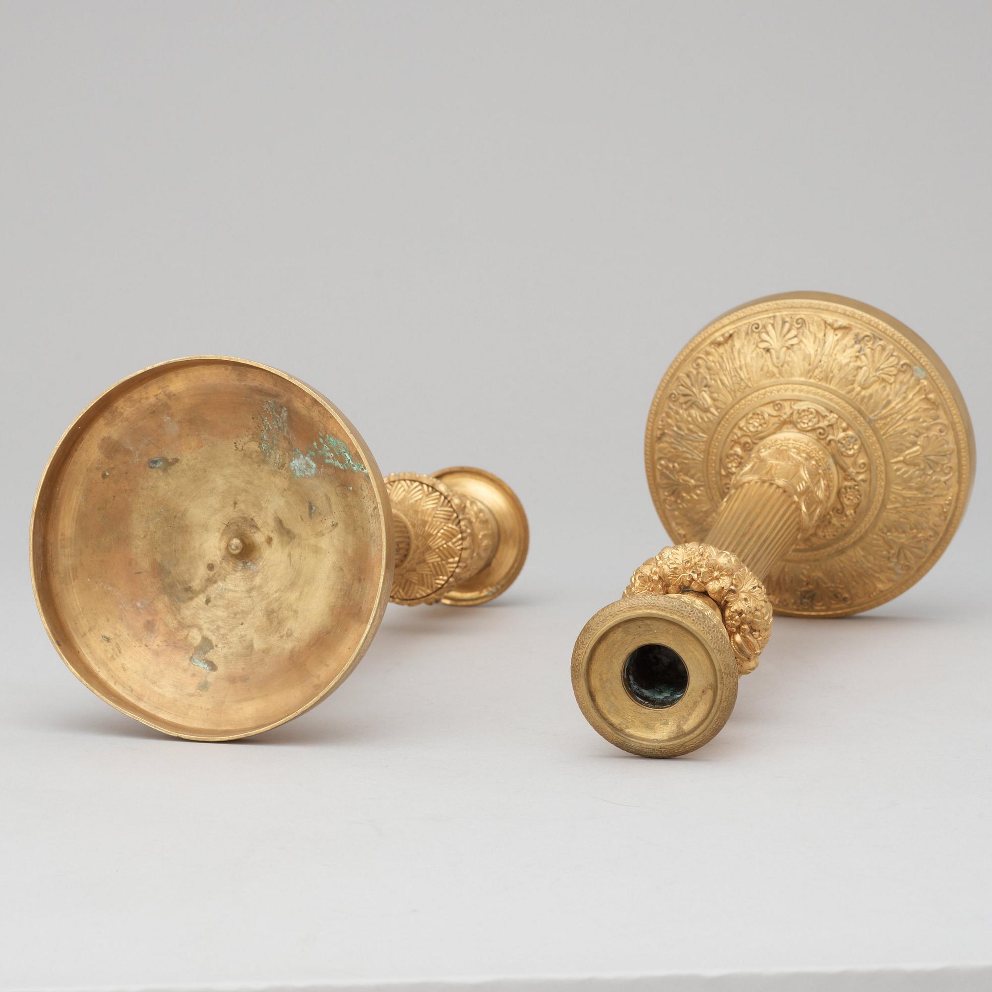 A pair of French Empire early 19th century candlesticks.