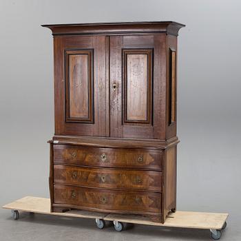 An 18th century oak and walnut cabinet.