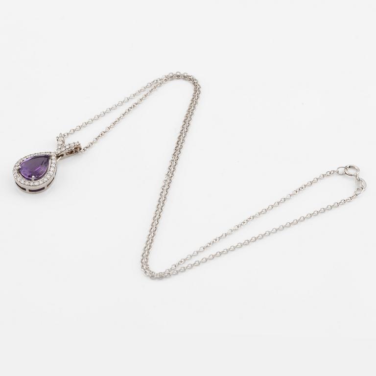 Pendant with chain in 18K gold set with a faceted amethyst and round brilliant-cut diamonds.