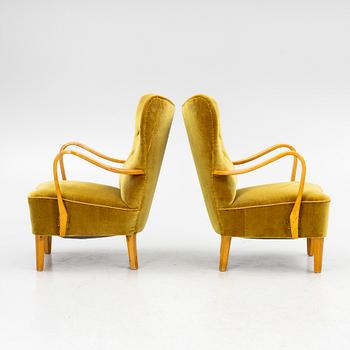 A pair of wingback armchairs, Sweden, first half of the 20th century.