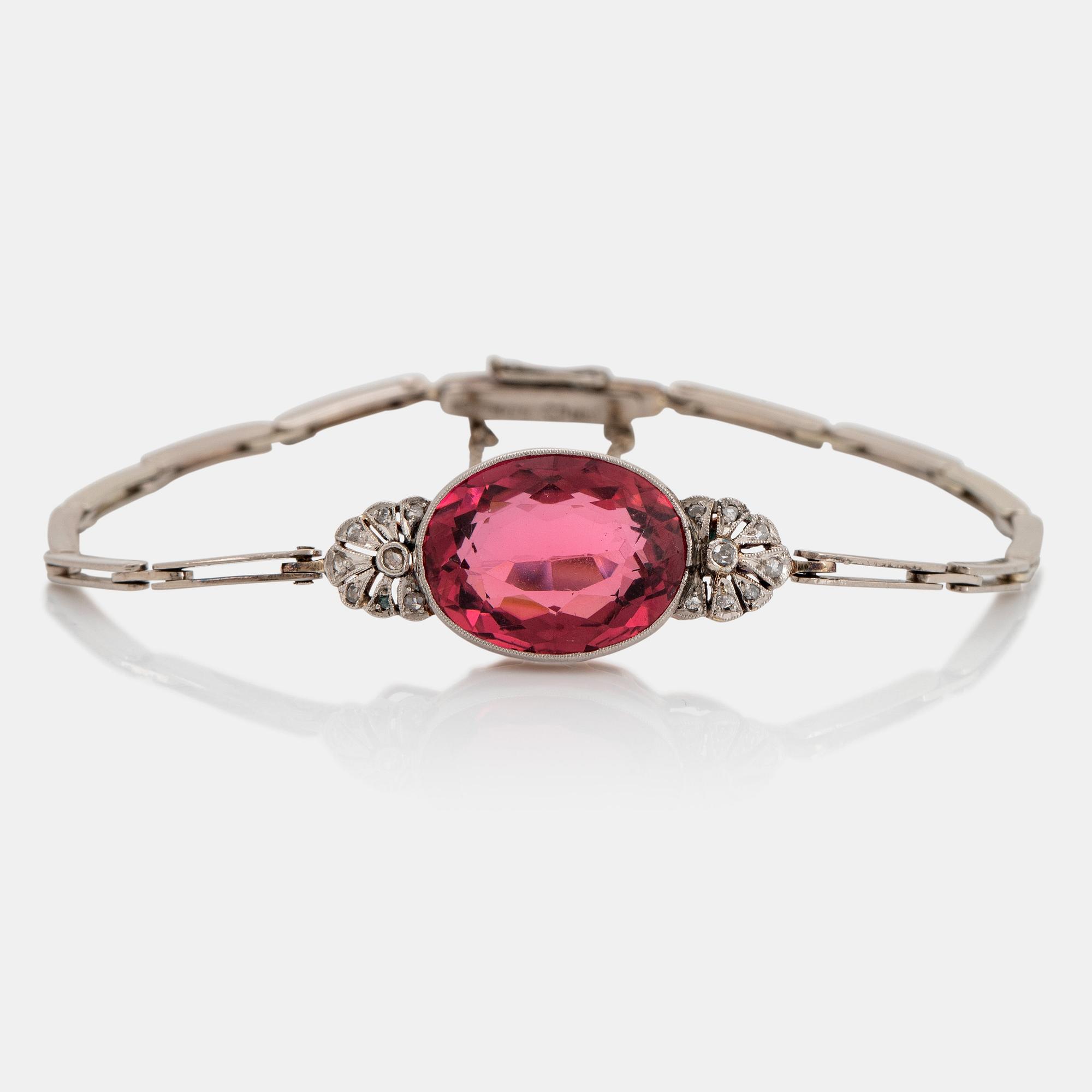 An 18K gold bracelet set with a faceted pink tourmaline weight ca 6.00 cts.