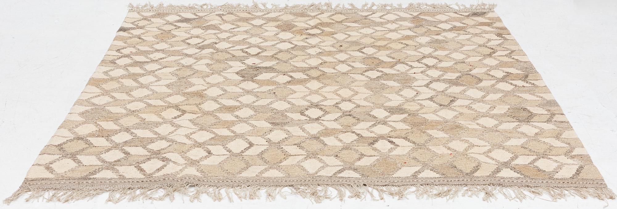 A Kelim carpet, c. 224 x 216 cm.