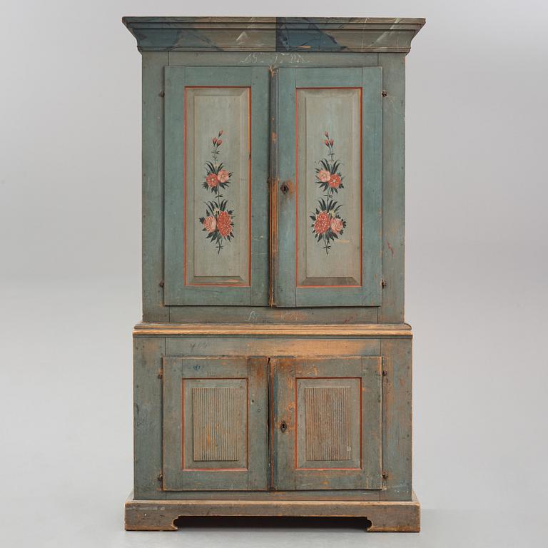 A polychrome-painted cabinet from Jämtland, Sweden, dated 1824.