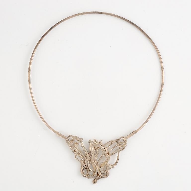 Lars Arby, three neck rings with pendants, silver, Gothenburg including 1977, 1978, and 1982.