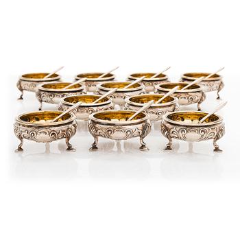 A set of 12 Russian silver salt cellars and 12 salt spoons, Sazikov 1860 & F. O. Fagerström 1850s-60s, Saint Petersburg.