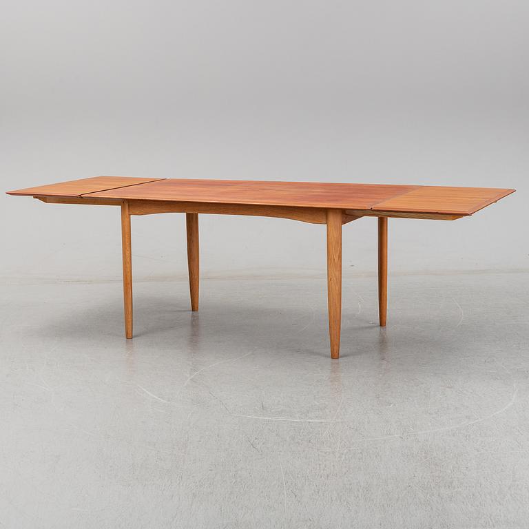 A 1950/60's dining table from Slagelse Møbelvaerk A/S with two additional leaves.