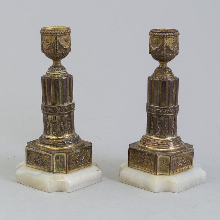 A PAIR OF BRASS AND ALABASTER GUSTAVIAN STYLE CANDLESTICKS, 19th century.