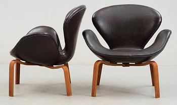A pair of Arne Jacobsen brown artificial leather 'Swan' easy chairs, Fritz Hansen 1966.