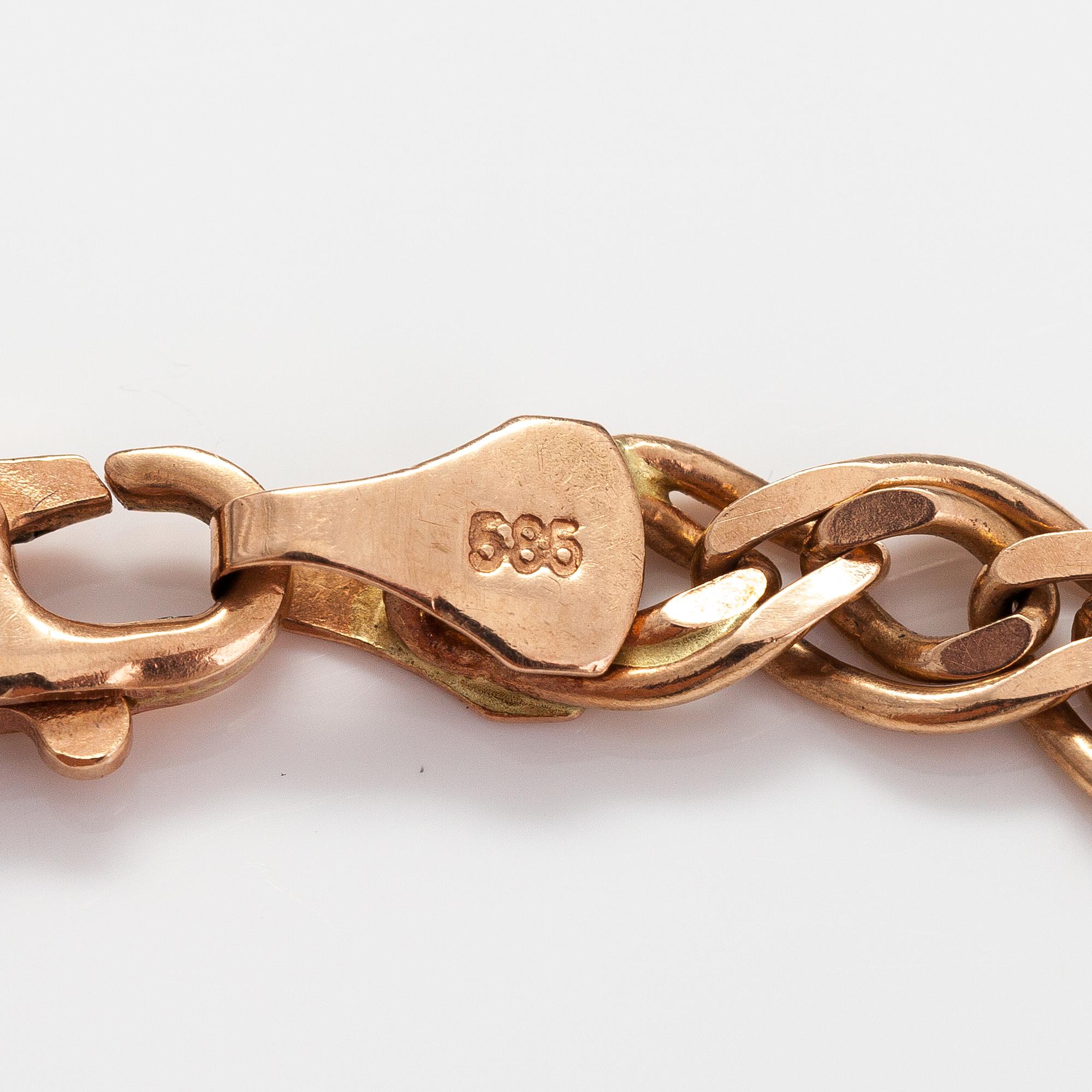 A 14K gold bracelet. Marked Midas.