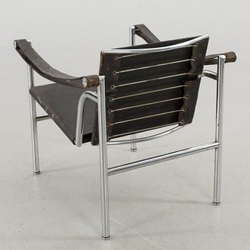 A "LC-1" ARMCHAIR DESIGNED BY LE CORBUSIER FOR CASSINA.