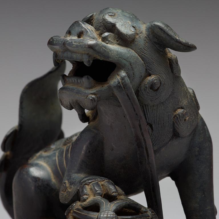 A bronze figure of a buddhist lion, Qing dynasty, 19th Century.