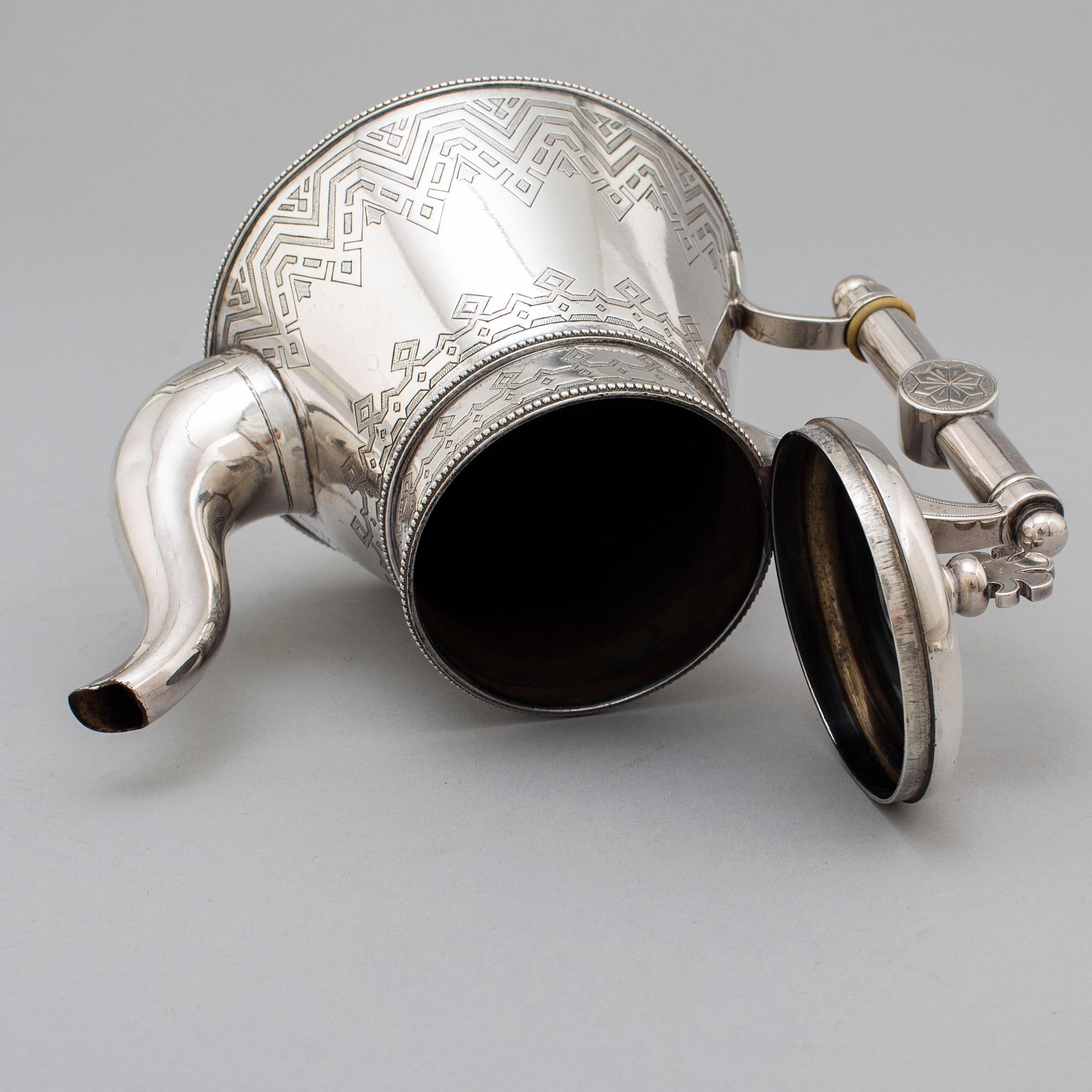 A Russian 19th century parcel-gilt silver tea pot and cream jug, mark possbly of Alexander Lokin, St. Petersburg 1893.
