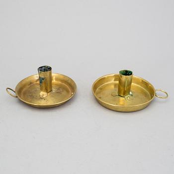 A lot of four brass candle sticks 18/19th century.