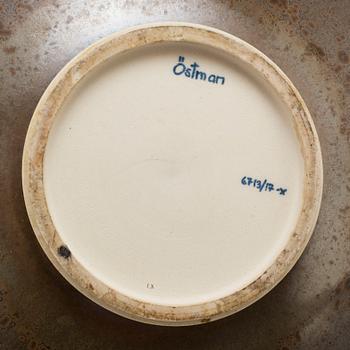 A stoneware dish by Lasse Östman, signed.